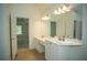 Bathroom featuring a double vanity with white cabinets, a large mirror and bright lighting at 3788 Westwick Nw Ct, Kennesaw, GA 30152