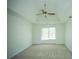 Large bedroom featuring tray ceilings and a ceiling fan at 3788 Westwick Nw Ct, Kennesaw, GA 30152