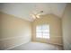 Bedroom with neutral carpet and large windows, providing ample natural light and a peaceful atmosphere at 3788 Westwick Nw Ct, Kennesaw, GA 30152