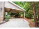 Attached carport with wood storage at 3788 Westwick Nw Ct, Kennesaw, GA 30152