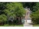 Beautiful brick home featuring a two-car garage, mature landscaping, and a well-manicured lawn at 3788 Westwick Nw Ct, Kennesaw, GA 30152