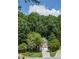 Charming two-story brick home with an attached two-car garage and a well-manicured lawn at 3788 Westwick Nw Ct, Kennesaw, GA 30152