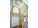 Bright foyer features a high ceiling, decorative chandelier, and staircase at 3788 Westwick Nw Ct, Kennesaw, GA 30152