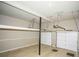 Spacious two car garage with overhead storage, shelving, and two insulated garage doors at 3788 Westwick Nw Ct, Kennesaw, GA 30152