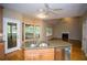 Bright kitchen with wooden cabinets, granite countertops, stainless steel appliances, and a view of the deck at 3788 Westwick Nw Ct, Kennesaw, GA 30152