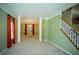Spacious living room with fresh green walls, large windows, and carpeting at 3788 Westwick Nw Ct, Kennesaw, GA 30152