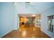Open concept living and kitchen area with hardwood floors, stainless steel appliances, and bright lighting at 3788 Westwick Nw Ct, Kennesaw, GA 30152