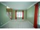 Bright living room featuring large windows with vibrant curtains at 3788 Westwick Nw Ct, Kennesaw, GA 30152