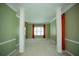 Open living room with decorative columns, window and carpeted floor at 3788 Westwick Nw Ct, Kennesaw, GA 30152