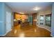 Open concept living and kitchen area with hardwood floors, wooden cabinets and stainless steel appliances at 3788 Westwick Nw Ct, Kennesaw, GA 30152