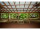 Covered patio with ceiling fans, decorative lights and plants, providing a great outdoor living space at 3788 Westwick Nw Ct, Kennesaw, GA 30152