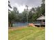 Community tennis court with a covered patio at 3788 Westwick Nw Ct, Kennesaw, GA 30152