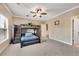 Comfortable bedroom with a large bunk bed, soft carpet, a ceiling fan, and a view to the hallway at 511 Baxter Way, Marietta, GA 30064