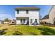 Grassy backyard with patio and chair set, ideal for relaxation and outdoor enjoyment at 9122 Golfview Cir, Covington, GA 30014
