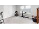A well-lit room featuring neutral walls, plush carpeting, and a closet with double doors at 9122 Golfview Cir, Covington, GA 30014