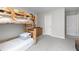 A charming bedroom featuring a wooden bunk bed and neutral carpeting at 9122 Golfview Cir, Covington, GA 30014