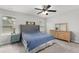 Bedroom featuring carpeted floors, a neutral color palette, and a comfortable bed with natural light from the windows at 9122 Golfview Cir, Covington, GA 30014