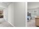Bright bedroom with gray carpet and natural light, featuring a comfortable bed and neutral wall paint at 9122 Golfview Cir, Covington, GA 30014