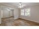 Bedroom featuring hardwood floors, neutral walls, and mirrored closet doors at 4485 Canary Ct, Lithia Springs, GA 30122