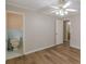 Bright bedroom featuring hardwood floors and an attached bathroom at 4485 Canary Ct, Lithia Springs, GA 30122