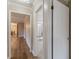 Hallway features hardwood floors and a partial view of a bedroom and dining area at 4485 Canary Ct, Lithia Springs, GA 30122