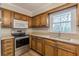 Kitchen featuring wooden cabinets, stainless steel appliances and plenty of natural light at 4485 Canary Ct, Lithia Springs, GA 30122