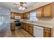 Kitchen features wooden cabinets, stainless steel appliances, and hardwood flooring at 4485 Canary Ct, Lithia Springs, GA 30122
