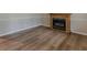 Cozy living room featuring wood-look flooring and a decorative fireplace at 4485 Canary Ct, Lithia Springs, GA 30122