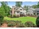 Expansive backyard featuring a lush lawn and mature trees at 6470 Long Island Nw Dr, Atlanta, GA 30328