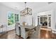 Sun-filled dining room with hardwood floors and views of the outdoors at 6470 Long Island Nw Dr, Atlanta, GA 30328