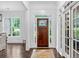 Elegant foyer with hardwood floors and glass-paned doors at 6470 Long Island Nw Dr, Atlanta, GA 30328