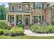 Charming front porch with seating area and meticulous landscaping at 6470 Long Island Nw Dr, Atlanta, GA 30328