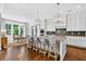 Modern kitchen with granite countertops, a large island, and stainless steel appliances at 6470 Long Island Nw Dr, Atlanta, GA 30328