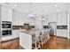 Elegant kitchen with white cabinets, stainless steel appliances, and a spacious island at 6470 Long Island Nw Dr, Atlanta, GA 30328