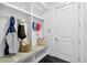 Well-organized mudroom with built-in bench, storage cubbies, and access to the interior at 6470 Long Island Nw Dr, Atlanta, GA 30328