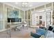 Comfortable home office with built-ins, ample workspace, and French doors at 6470 Long Island Nw Dr, Atlanta, GA 30328