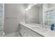 Bathroom features double sinks, stone countertops, and modern fixtures at 2125 Parkside Ln, Roswell, GA 30076