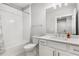 Bathroom featuring a shower and bathtub combination with a sleek, modern design at 2125 Parkside Ln, Roswell, GA 30076