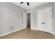 Bedroom with a ceiling fan and an entrance to a closet and another room at 2125 Parkside Ln, Roswell, GA 30076