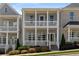 Charming two-story home with a double porch, complemented by manicured landscaping and sidewalk appeal at 2125 Parkside Ln, Roswell, GA 30076