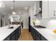 Gourmet kitchen features a large island with white countertops, stainless appliances and modern lighting at 2125 Parkside Ln, Roswell, GA 30076