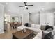 Open-concept living area flows into the dining space, featuring lots of natural light and neutral tones at 2125 Parkside Ln, Roswell, GA 30076