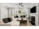 Living room with large windows, modern fireplace and flat screen TV at 2125 Parkside Ln, Roswell, GA 30076
