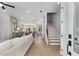 Spacious open-concept living room with lots of natural light and wood floors leading to stairs at 2125 Parkside Ln, Roswell, GA 30076