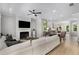 Bright living room with a fireplace, TV and adjacent dining area at 2125 Parkside Ln, Roswell, GA 30076