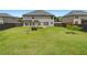 Spacious backyard with well-maintained lawn and a wooden fence at 622 Madison Park Dr, Grayson, GA 30017