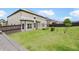Large backyard featuring lush green grass, trees, and a wood fence at 622 Madison Park Dr, Grayson, GA 30017
