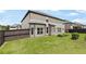 Well-kept backyard showcasing a manicured lawn, privacy fence, and an inviting outdoor living space at 622 Madison Park Dr, Grayson, GA 30017