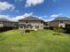 Large backyard surrounded by privacy fence with a well-maintained lawn at 622 Madison Park Dr, Grayson, GA 30017