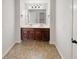 Bathroom featuring a double sink vanity with dark wood cabinets at 622 Madison Park Dr, Grayson, GA 30017